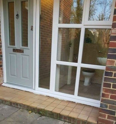 House with open window seeing into restroom