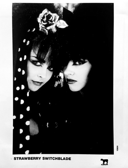 Black and white photo. Face to face from the side, turned to the camera.