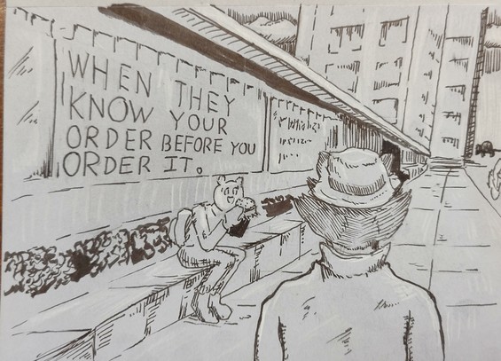 A'kon walks by a food court. "When they know your order before you order it." a slogan says.